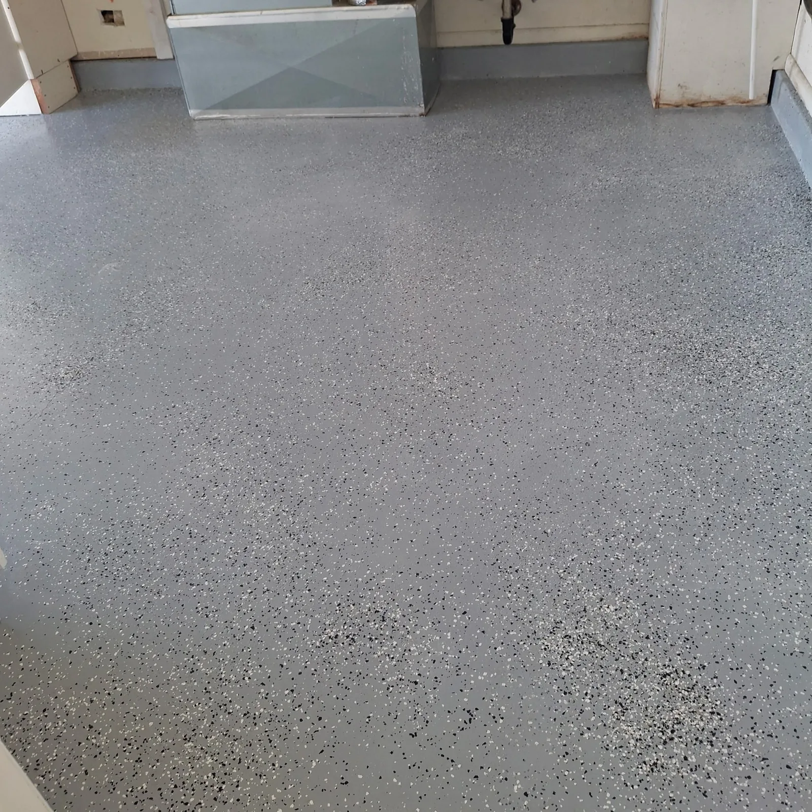 Grey epoxy garage floor coating with decorative flake